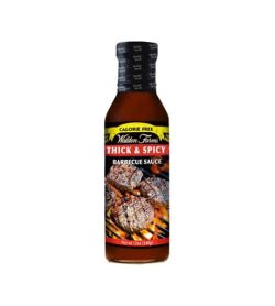 Brown bottle with black cap of Walden Farms Thick & Spicy Barbecue Sauce shown in white background