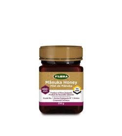 Clear bottle with gold cap of Flora Manuka Honey Product of New Zealand 400 MGO contains 250g