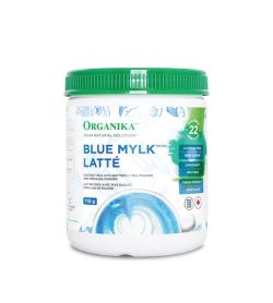 White container with green lid and blue letters on the label of Organika Blue Mylk Latte containing 110 g