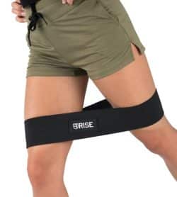 Women exercising with black Rise Hip Resistance Band shows how to use the resistance band