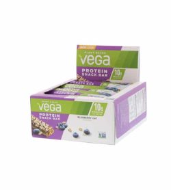 Purple and white box shown open of Vega plant based protein snack bar with blueberry oat flavour